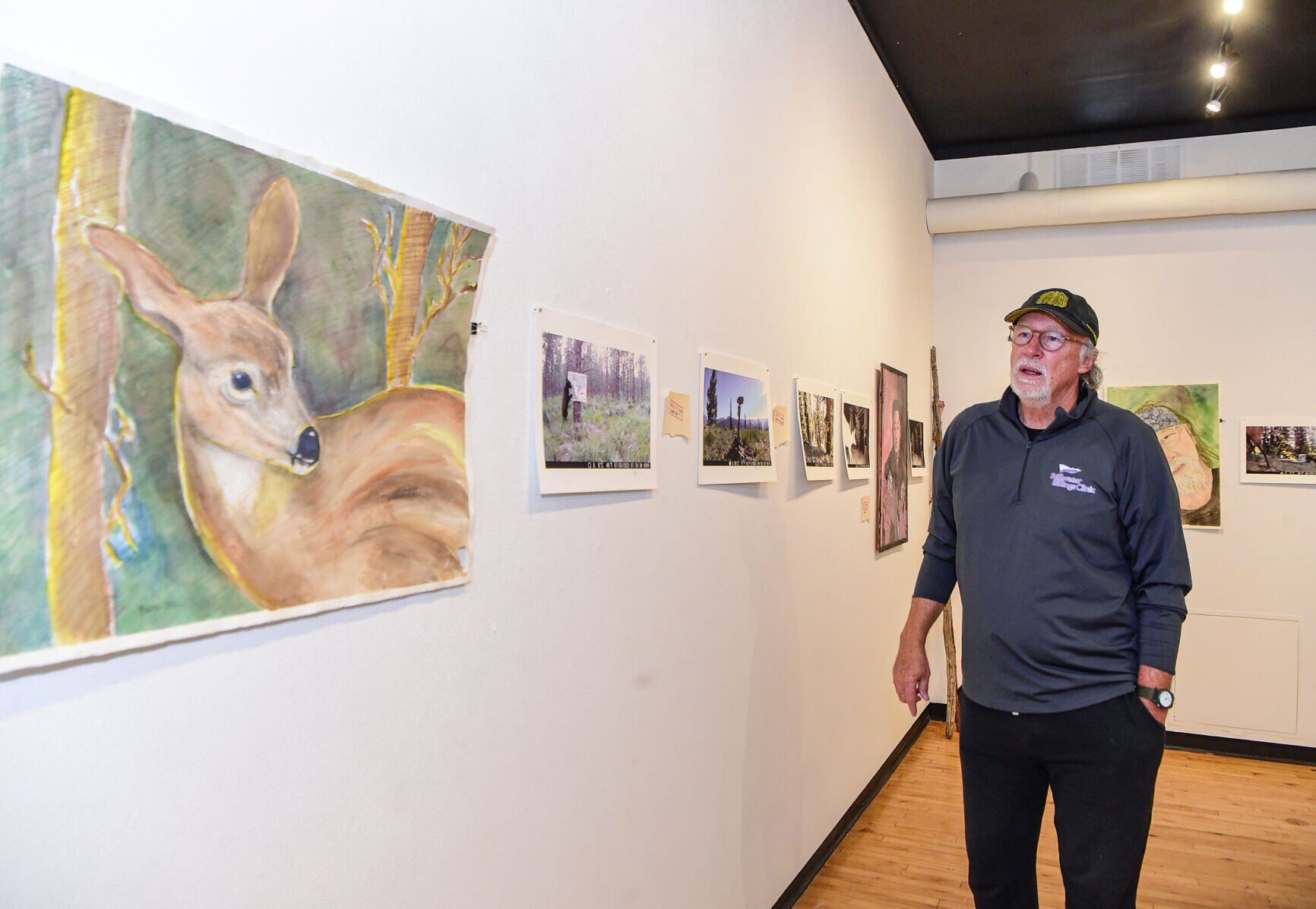 Jim Baken displays artwork for animals at Rocky